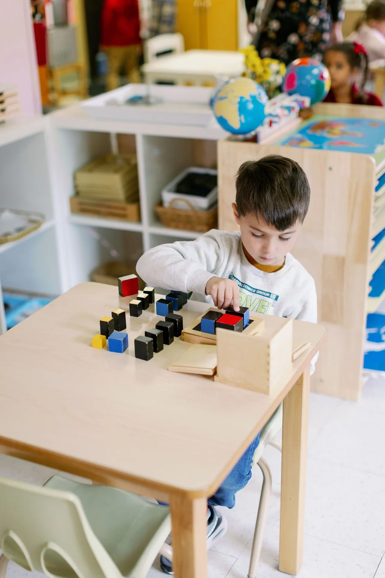 Child working with the binomial cube