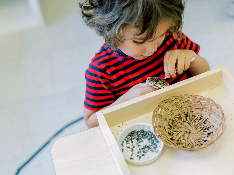 little girl making crafts